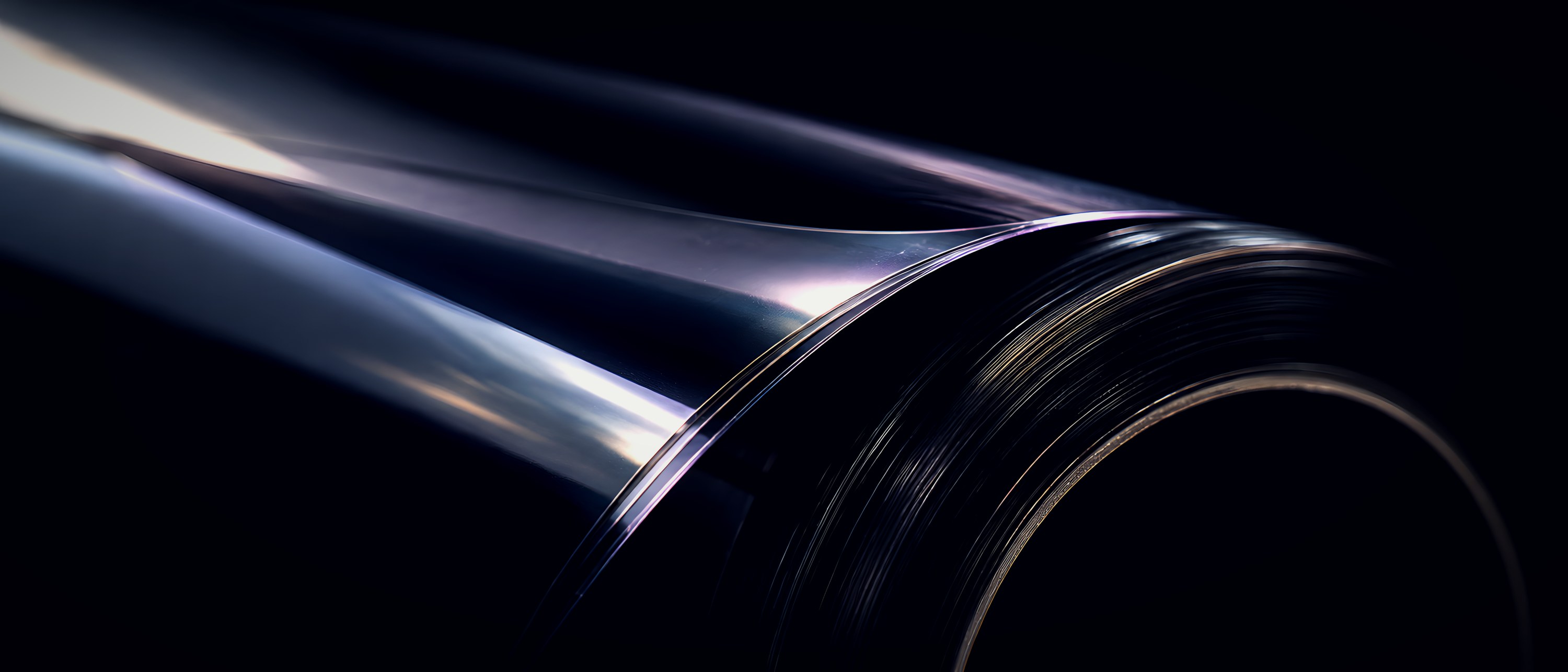 Macro of a roll of window film catching a raking light